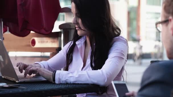 Businesswoman working on laptop in cafe - Filmati, video
