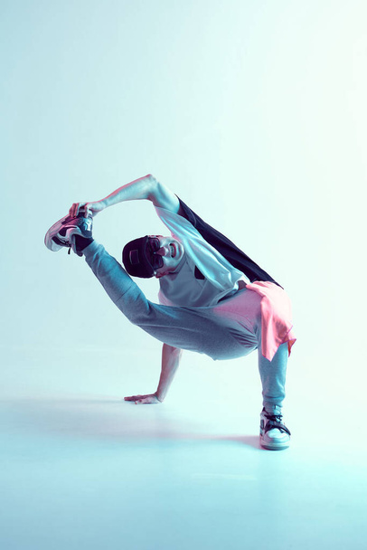 Stylish breakdancer guy dancing hip-hop in neon light. Dance school poster. Battle competition announcement - Foto, imagen