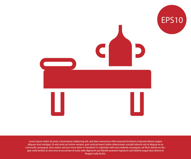 Vörös Masszázs asztal olaj ikon elszigetelt fehér háttér. Vektor - Vektor, kép