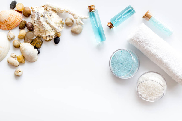 Spa set of blue sea salt, cosmetic clay and aroma oil. Top view - Fotó, kép