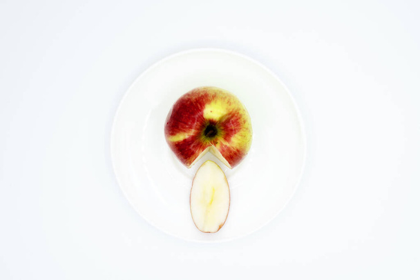 ripe bright and juicy apple on a plate - Photo, Image