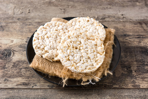 Puffed rice cakes on wooden table - Photo, Image