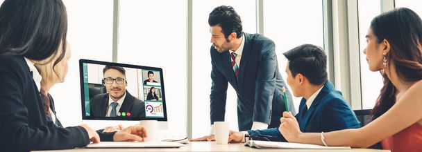 Video call group business people meeting on virtual workplace or remote office. Telework conference call using smart video technology to communicate colleague in professional corporate business. - Photo, Image