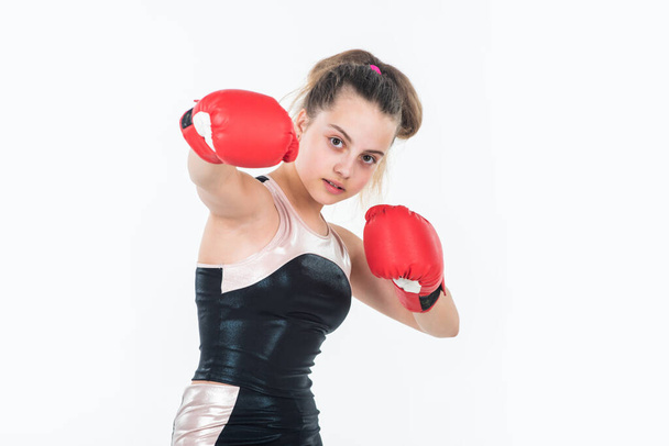 small girl training in boxing gloves. sport and fitness. teen girl boxer. sportswear and equipment shop. healthy lifestyle. energetic kids power. child workout in gym isolated on white - 写真・画像