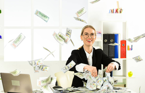 she earn dollars. modern life and business. corporate leather bag. sexy woman with case at workstation. happiness and success. Businesswoman holding briefcase. suitcase with money. good deal - 写真・画像