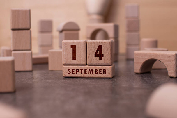 September 14 written with wooden blocks - Foto, afbeelding