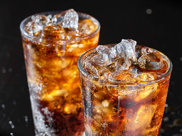 two cups of cold cola soft drink with ice - Fotó, kép