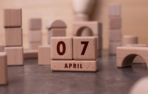 April 7 written with wooden blocks - Foto, imagen
