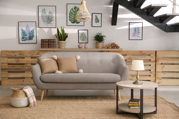Modern comfortable sofa in stylish living room interior - Foto, imagen