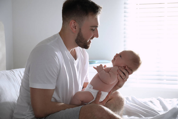 Father with his newborn son at home - Photo, image