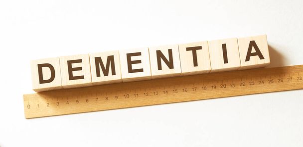 Word DEMENTIA made with wood building blocks - Photo, image
