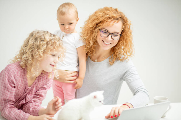 positive awesome mommy and her children enjoying video animation - Photo, Image