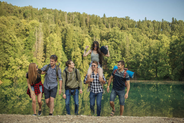 cheerful hipsters going hiking around the region - Photo, Image
