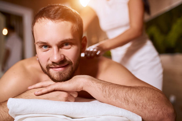 Charming man in massage salon - Φωτογραφία, εικόνα