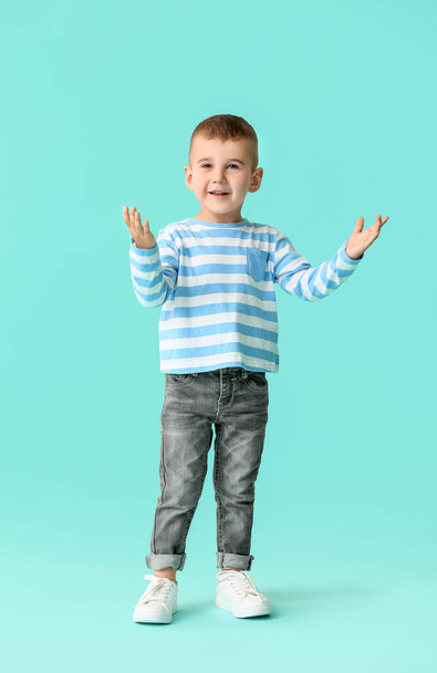 Cute little boy on color background - Photo, image