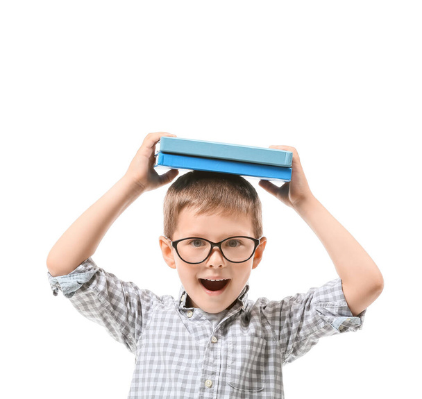 Cute little boy with books on white background - Photo, Image