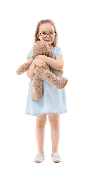 Cute little girl with toy bear on white background - Foto, Imagem