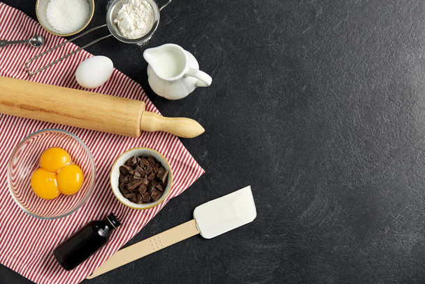 rolling pin, milk, eggs, flour and chocolate - Zdjęcie, obraz