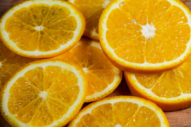 Background of sliced juicy oranges fruit - Foto, Imagen