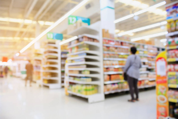 Supermarket interior blur background with customers - Foto, afbeelding