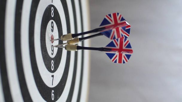 Dart hitting bulls eye, single shot bulls-eye. Concept of successful business ideas hitting the exact center of the target. Perfect performance of the task and superiority over the rivals. - Фото, изображение