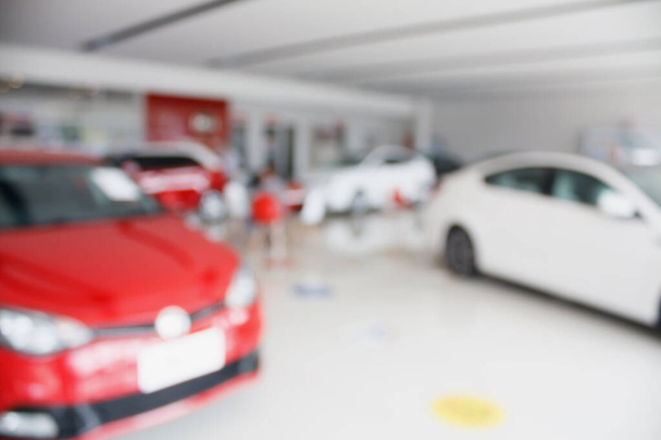 new car at new car showroom dealership blurred background - Photo, Image
