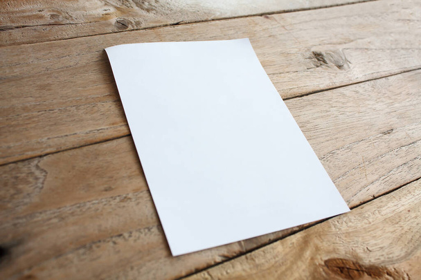 Blank paper on wood table - Foto, immagini