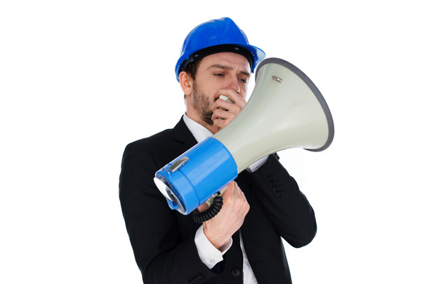 Businessman wearing a hardhat holding a megaphone - Foto, Imagem