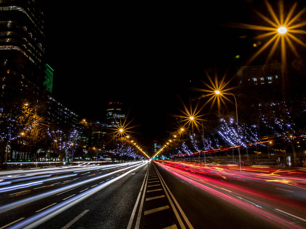 A long exposure lights over a highway at night in Madrid - Zdjęcie, obraz