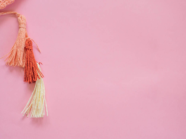 Pompoms on pink background with copy space - Photo, Image