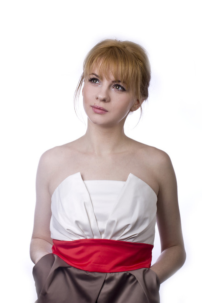 Красивая эмоциональная блондинка в коротком платье на белом фоне
 - Фото, изображение