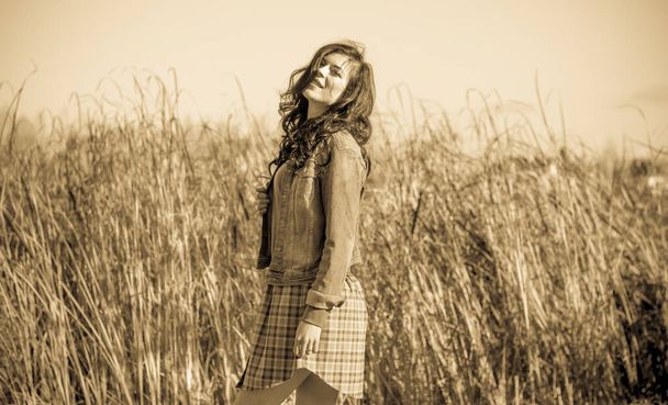Autumn fashionable ideas. Woman in jeans jacket and plaid  dress . Modern fashion - Photo, Image