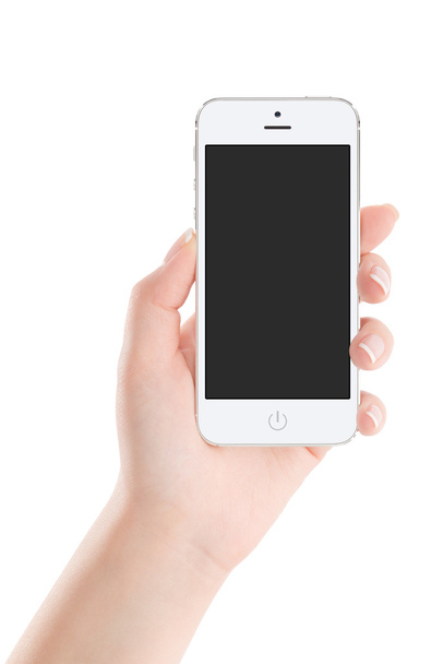 Téléphone intelligent mobile blanc avec écran blanc à la main féminine
 - Photo, image