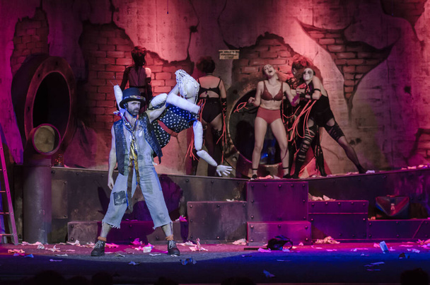 DNIPRO, UKRAINE - AUGUST 5, 2020: Fantastic and absurd story STRIP-TEASE based on the play by Slavomir Mrozhek performed by members of the Dnipro State Drama and Comedy Theatre. - 写真・画像