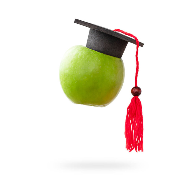 pomme avec casquette graduée sur fond blanc isolé - Photo, image