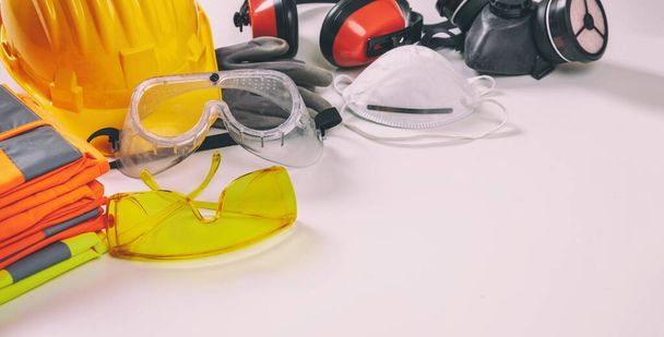 Work safety protection equipment flat lay. Industrial protective gear on white background, closeup view. Construction site health and safety concept - Fotoğraf, Görsel