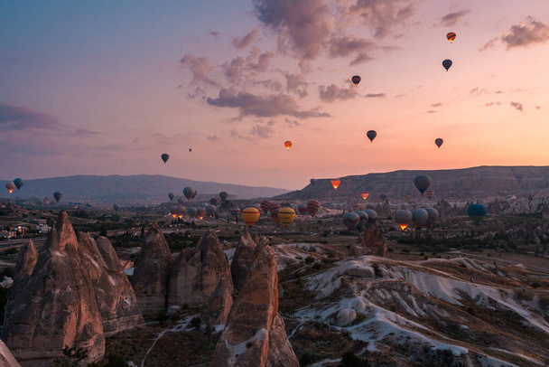 Hot Air balloons flying tour over Mountains landscape during sunrise Cappadocia, Goreme National Park - Valokuva, kuva