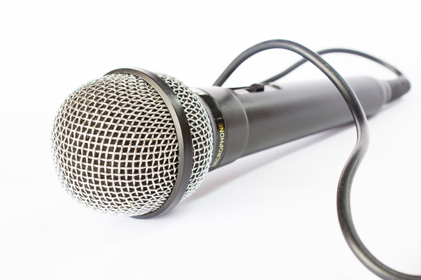 micrófono con alambre negro aislado en blanco
 - Foto, Imagen