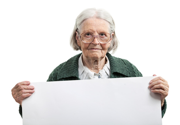 Happy elderly lady holding blank sheet in hand - Photo, Image