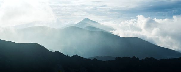 Panorama of beauty blue foggy mountains range - Photo, image