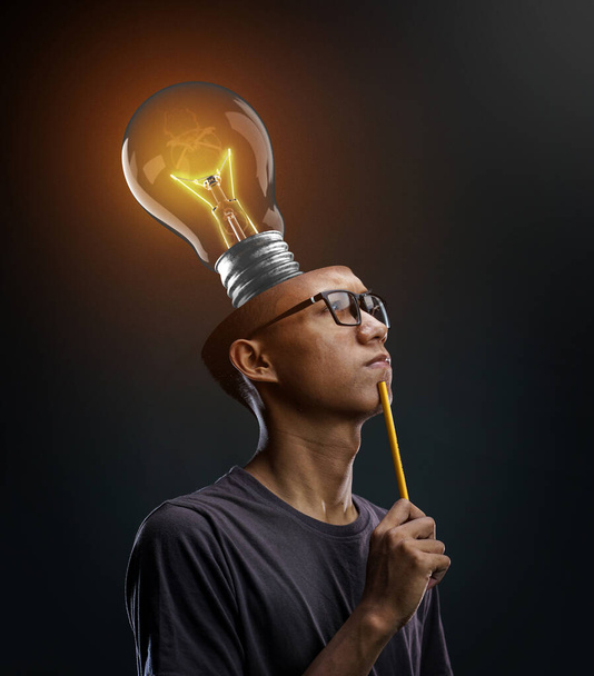 Creative Brain Thinking. Glowing Bulb Inside Man's Head. Photo Manipulation Concept - Photo, Image