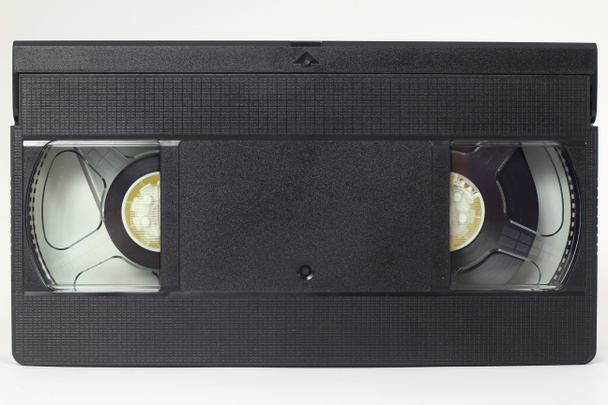 Black VHS video tape cassette with blank label isolated on white background - Photo, Image