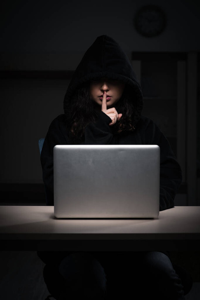 Female hacker hacking security firewall late in office - Foto, Bild
