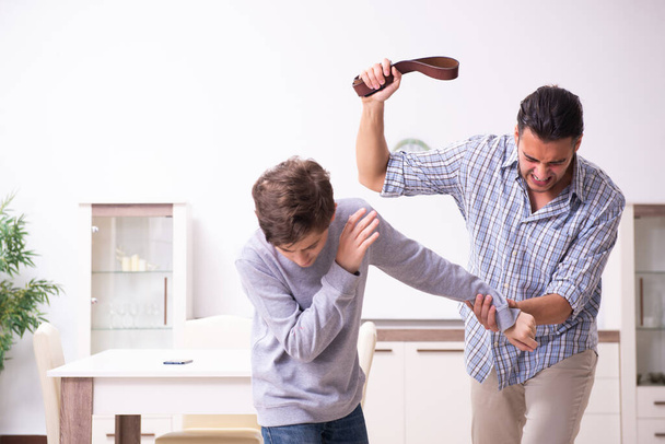 Father beating and punishing his sone - Fotoğraf, Görsel