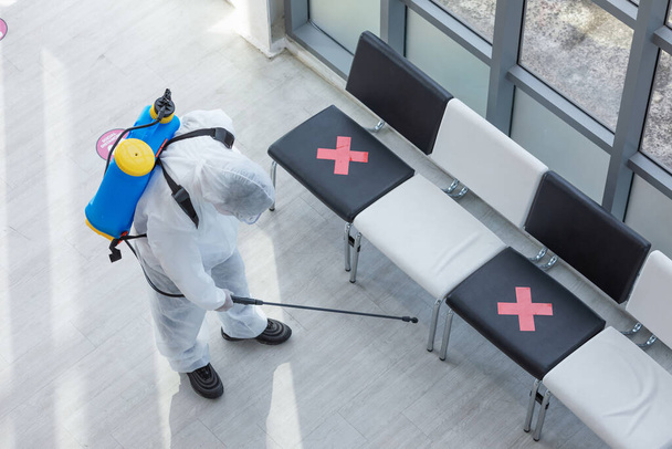 Cleaning and Disinfection at office amid the coronavirus epidemic Professional teams for disinfection efforts Infection prevention and control of epidemic Protective suit and mask. - Photo, Image