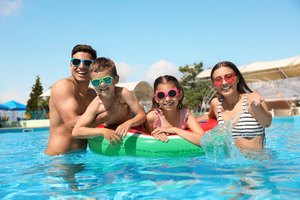Happy family in swimming pool. Summer vacation - Fotoğraf, Görsel