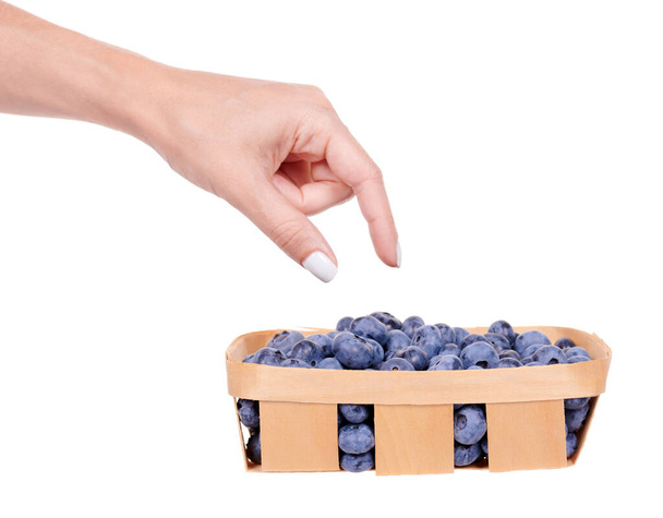 Fresh raw blueberry in wooden basket. - Foto, Imagem