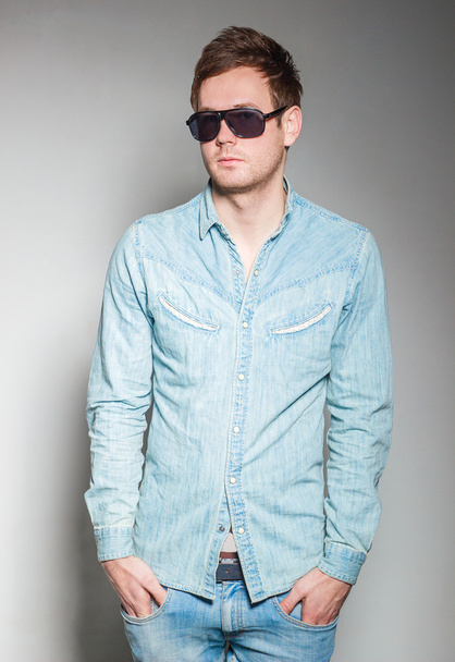 a handsome guy with glasses and a denim shirt - Zdjęcie, obraz