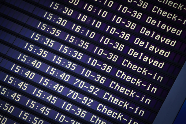 Flights information board in airport terminal - Foto, imagen
