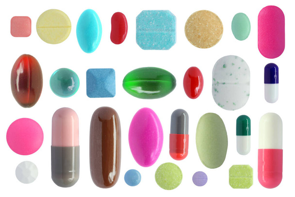 Pilules colorées isolées sur fond blanc - Photo, image